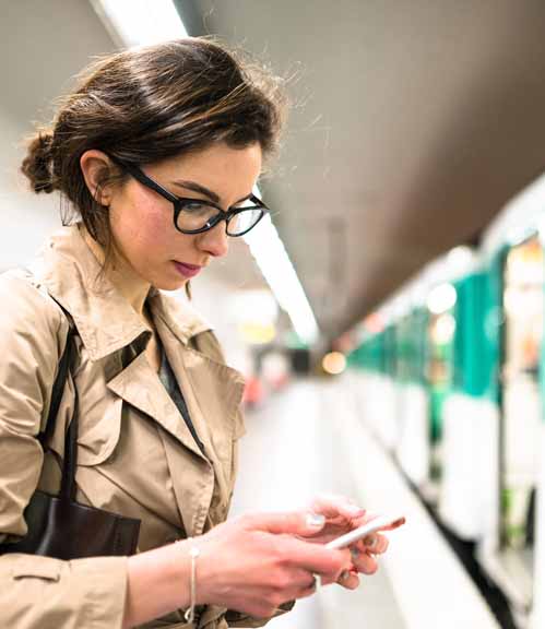 Hero-woman-on-mobile-phone-undergroud-station