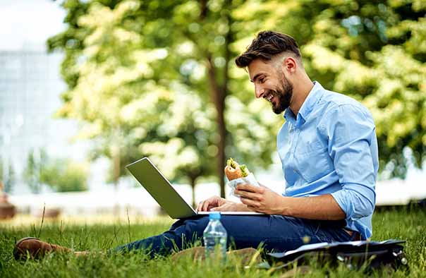 working-on-wireless-laptop-during-lunch-outside